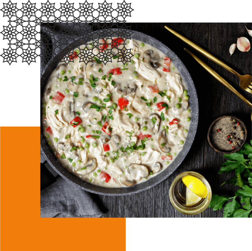 A bowl of food on a wooden table.