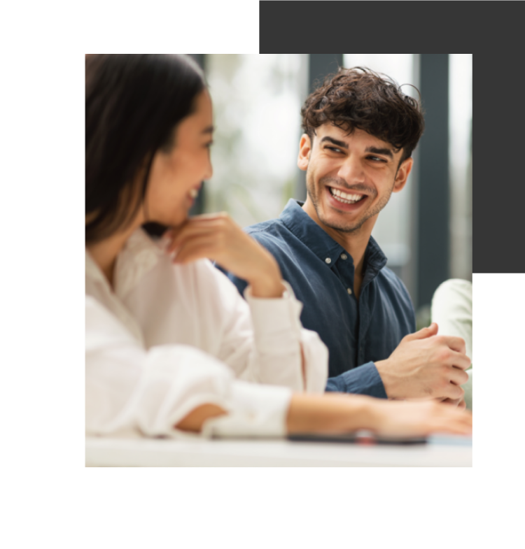 A man and a woman sitting at a table.