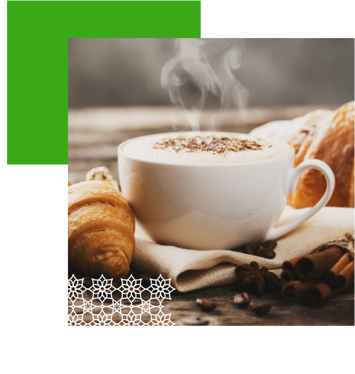 A picture of a cup of coffee and some bread.